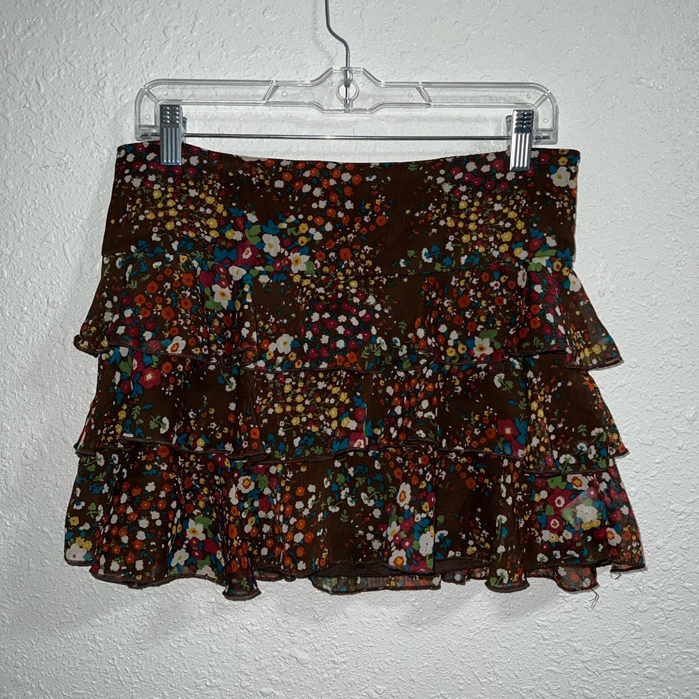 brown xhilaration layered mini skirt. colorful flower pattern